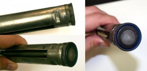 A carbon mainspring with heavy buildup and damage caused by dieseling.